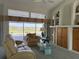 Cozy living room with lake views, comfortable seating, neutral tones, and custom built-in shelving at 507 Monaco Dr, Punta Gorda, FL 33950