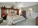 Bright bedroom showcasing a floral bedspread, wood furnishings, and a ceiling fan at 507 Monaco Dr, Punta Gorda, FL 33950
