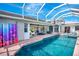 Expansive backyard with a sparkling pool and spa, perfect for outdoor entertaining and relaxation at 507 Monaco Dr, Punta Gorda, FL 33950