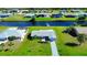 Aerial view of neighborhood homes with canals and boat access at 61 Caddy Rd, Rotonda West, FL 33947