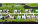 Real estate from above with manicured lawns, waterfront access, and serene street layout at 61 Caddy Rd, Rotonda West, FL 33947