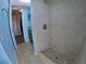 Tiled shower featuring a shower head with neutral colored tile at 61 Caddy Rd, Rotonda West, FL 33947