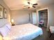 Bedroom with a ceiling fan, a closet, and a chair by the bed at 61 Caddy Rd, Rotonda West, FL 33947