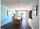 Dining room features a chandelier and views of the pool and waterfront at 61 Caddy Rd, Rotonda West, FL 33947