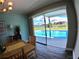 Dining area with a pool view and wooden table set at 61 Caddy Rd, Rotonda West, FL 33947