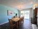 Open dining area with a view of the waterfront and access to the kitchen at 61 Caddy Rd, Rotonda West, FL 33947