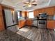 Spacious kitchen features stainless appliances, tiled backsplash, and modern fixtures at 61 Caddy Rd, Rotonda West, FL 33947