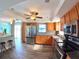 Well appointed kitchen offering stainless appliances and bar seating at 61 Caddy Rd, Rotonda West, FL 33947