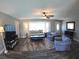 Inviting living area with plenty of natural light and comfortable seating arrangement at 61 Caddy Rd, Rotonda West, FL 33947