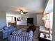 Bright and inviting living room with neutral walls, wood-look floors, and a comfortable seating arrangement at 61 Caddy Rd, Rotonda West, FL 33947