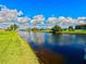 Picturesque canal front view, showcasing lush greenery and the tranquil water at 61 Caddy Rd, Rotonda West, FL 33947