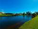 Scenic view of waterfront property, featuring a waterway and lush greenery at 61 Caddy Rd, Rotonda West, FL 33947