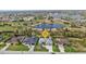 Home and surrounding neighborhood identified on aerial real estate photo with golf course in background at 664 Rotonda Cir, Rotonda West, FL 33947
