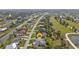 Home and neighborhood identified on aerial real estate photo, showing close proximity to a nearby canal at 664 Rotonda Cir, Rotonda West, FL 33947