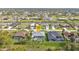House marked on aerial real estate photo, showing neighboring homes with pools and fenced yards at 664 Rotonda Cir, Rotonda West, FL 33947