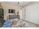 Bedroom with TV, closet and natural light at 664 Rotonda Cir, Rotonda West, FL 33947