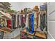 Organized walk-in closet featuring tiered shelving and hanging storage at 664 Rotonda Cir, Rotonda West, FL 33947