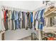 Walk-in closet with metal shelving and lots of hanging storage at 664 Rotonda Cir, Rotonda West, FL 33947