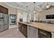 Gourmet kitchen with granite countertops, stainless steel appliances, and a breakfast bar at 664 Rotonda Cir, Rotonda West, FL 33947
