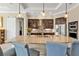 Close-up of kitchen island with granite countertops, pendant lighting, and stainless steel appliances at 664 Rotonda Cir, Rotonda West, FL 33947