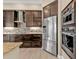 Chef's kitchen with granite countertops, stainless steel appliances, and a tile backsplash at 664 Rotonda Cir, Rotonda West, FL 33947