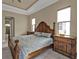 Spacious main bedroom with wood-look floors and bedside tables at 664 Rotonda Cir, Rotonda West, FL 33947