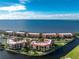 An aerial view of the building complex and the beautiful views of the bay at 87 Vivante Blvd # 8732, Punta Gorda, FL 33950