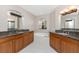 Spacious bathroom with granite counters, double sinks, and a soaking tub at 87 Vivante Blvd # 8732, Punta Gorda, FL 33950