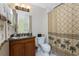 Bathroom featuring a vanity, granite countertop, palm tree shower curtain, and tile flooring at 87 Vivante Blvd # 8732, Punta Gorda, FL 33950