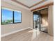 Bedroom featuring a large window and sliding glass doors with stunning water views at 87 Vivante Blvd # 8732, Punta Gorda, FL 33950