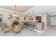 Dining area adjacent to the kitchen with modern pendant lighting at 87 Vivante Blvd # 8732, Punta Gorda, FL 33950