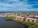 A beautiful coastal community with waterfront condos, red tile roofs, and a wide view of the area at 87 Vivante Blvd # 8732, Punta Gorda, FL 33950