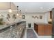 Open kitchen with granite countertops, stainless steel appliances, and ample cabinet space at 87 Vivante Blvd # 8732, Punta Gorda, FL 33950