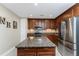 Kitchen featuring stainless steel appliances, granite countertops, and custom cabinetry at 87 Vivante Blvd # 8732, Punta Gorda, FL 33950