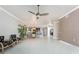 Open floor plan with tile flooring, ceiling fan, and dining area at 87 Vivante Blvd # 8732, Punta Gorda, FL 33950