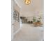 Open floorplan featuring tile flooring, dining room, living room, and access to the balcony at 87 Vivante Blvd # 8732, Punta Gorda, FL 33950