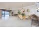 Open floorplan featuring tile flooring, dining room, living room, and access to the balcony at 87 Vivante Blvd # 8732, Punta Gorda, FL 33950