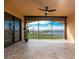 Enclosed lanai with tile flooring, ceiling fan, and beautiful water views at 87 Vivante Blvd # 8732, Punta Gorda, FL 33950