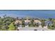Stunning aerial view showcases a residential neighborhood with waterfront properties boasting beautiful landscaping at 12905 N Marsh Dr, Port Charlotte, FL 33953