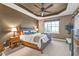 Comfortable bedroom with a large window, ceiling fan, and tasteful decor at 12905 N Marsh Dr, Port Charlotte, FL 33953
