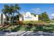 Welcome to Riverwood, a deed-restricted community, framed by lush landscaping at 12905 N Marsh Dr, Port Charlotte, FL 33953