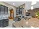 Gourmet kitchen with dark wood cabinets and stainless steel appliances at 12905 N Marsh Dr, Port Charlotte, FL 33953