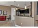 Kitchen featuring granite countertops, dark cabinetry, and stainless steel refrigerator at 12905 N Marsh Dr, Port Charlotte, FL 33953