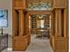 A home office space with wood trim and built in bookshelves at 12905 N Marsh Dr, Port Charlotte, FL 33953