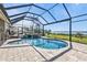 Beautiful pool with a spa, waterfall feature, and waterfront view at 12905 N Marsh Dr, Port Charlotte, FL 33953