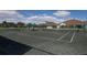 Tennis court with a sheltered bench area near a building in the community at 12905 N Marsh Dr, Port Charlotte, FL 33953