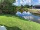 Beautiful view of the pond in the backyard adds nature and beauty to this property at 13902 Allamanda Cir, Port Charlotte, FL 33981