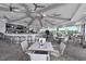 Clubhouse indoor/outdoor restaurant featuring a full bar, tv, ceiling fans, and seating at 14091 Heritage Landing Blvd # 123, Punta Gorda, FL 33955
