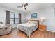 Charming bedroom with natural light, a cozy chair, and a wooden-framed bed at 1423 Mediterranean Dr # C, Punta Gorda, FL 33950
