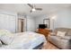 Comfortable bedroom featuring a ceiling fan, closet and a recliner seat at 1423 Mediterranean Dr # C, Punta Gorda, FL 33950